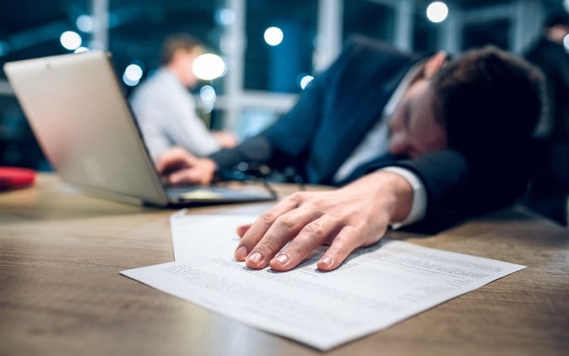 Businessman burned out from working late