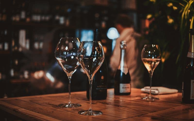 empty wine glasses on bar